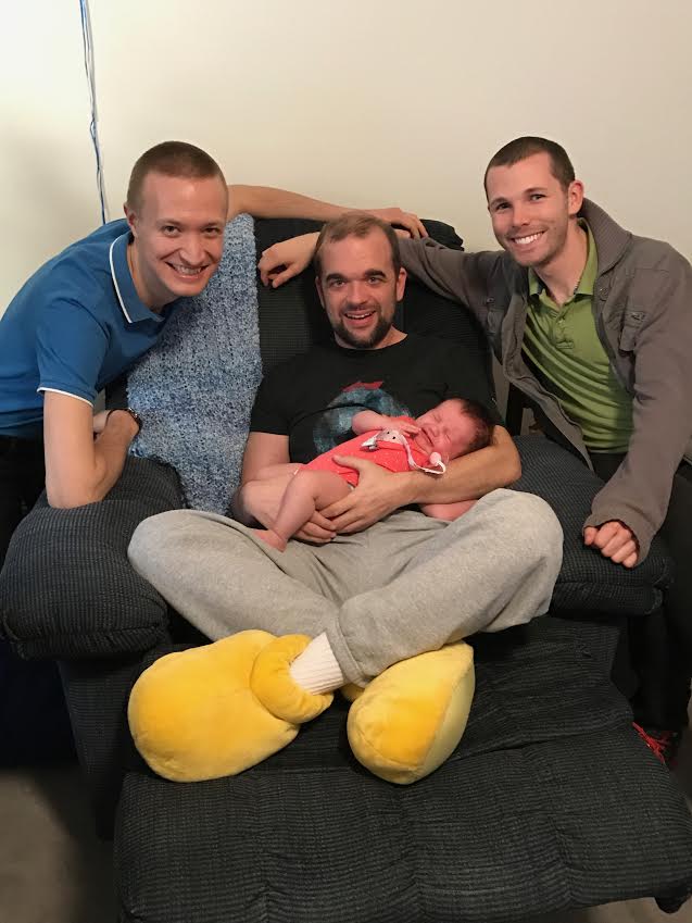 Matt with friends and baby